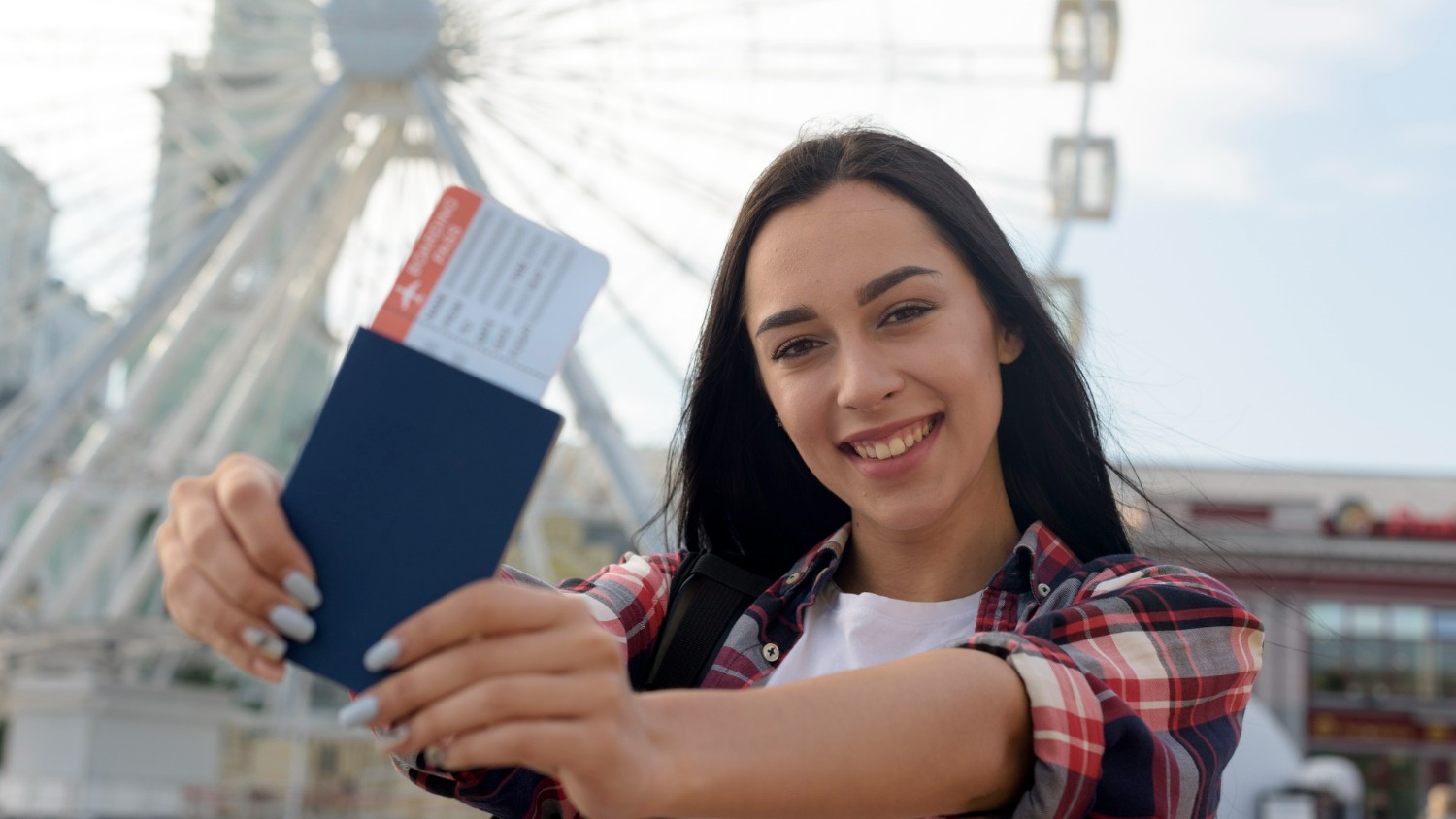 Woman holding a plane ticket to Spain